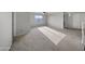 The large bonus room boasts natural light and plush carpet, perfect for flexible living at 9719 W Heber Rd, Tolleson, AZ 85353