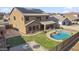 This two-story home features a private pool, lush landscaping, and outdoor living space at 9719 W Heber Rd, Tolleson, AZ 85353