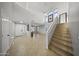 Bright foyer with tile flooring, staircase, and a view into the living spaces at 9719 W Heber Rd, Tolleson, AZ 85353