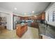 Spacious kitchen with stainless steel appliances, granite countertops, and ample cabinet space at 9719 W Heber Rd, Tolleson, AZ 85353