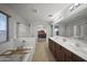 This primary bathroom has a soaking tub, walk-in shower, double vanity, and private commode at 9719 W Heber Rd, Tolleson, AZ 85353