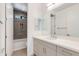Bright bathroom featuring a quartz countertop, bathtub, and unique decorative tiling in the shower at 100 W Northern Ave # 12, Phoenix, AZ 85021