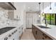 Open-concept kitchen with modern appliances, a center island, and stylish backsplash with plenty of storage at 100 W Northern Ave # 12, Phoenix, AZ 85021