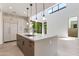 Bright and airy kitchen featuring a center island, stainless appliances, and a great view of backyard at 100 W Northern Ave # 12, Phoenix, AZ 85021