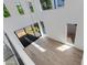 Bright, expansive living area with hardwood floors and several windows throughout at 100 W Northern Ave # 12, Phoenix, AZ 85021