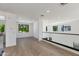 Loft area featuring hardwood floors and black framed windows with scenic outdoor view at 100 W Northern Ave # 12, Phoenix, AZ 85021