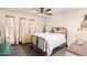 Cozy bedroom with natural light, carpet, ceiling fan, and vintage decor at 10161 W Thunderbird Blvd, Sun City, AZ 85351