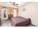 Comfortable bedroom featuring carpet, ceiling fan, and classic furnishings at 10161 W Thunderbird Blvd, Sun City, AZ 85351