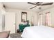 Bedroom with carpet, ceiling fan, vintage decor, and light from the windows at 10161 W Thunderbird Blvd, Sun City, AZ 85351