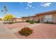 Quaint home featuring desert-style landscaping, including a walkway, decorative rock, and desert flora at 10161 W Thunderbird Blvd, Sun City, AZ 85351