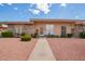 Inviting single-story house with a tidy front yard featuring desert landscaping and a clear pathway to the front door at 10161 W Thunderbird Blvd, Sun City, AZ 85351