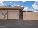 View of the garage and gate with clear signage of the house number at 10161 W Thunderbird Blvd, Sun City, AZ 85351