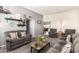 Comfortable living room with plush couches and chairs, providing ample seating for relaxation and gatherings at 10161 W Thunderbird Blvd, Sun City, AZ 85351