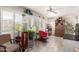 Bright sunroom with a ceiling fan, shuttered windows, and whitewashed wood flooring at 10161 W Thunderbird Blvd, Sun City, AZ 85351