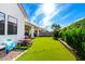 The backyard features a playground and green turf, perfect for outdoor activities and enjoyment at 10206 E Texas Ave, Mesa, AZ 85212