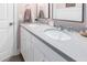 A double sink vanity with white cabinets and grey countertops makes this bathroom shine at 10206 E Texas Ave, Mesa, AZ 85212
