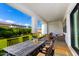 Inviting covered patio with outdoor seating, string lights, and a view of the lush backyard at 10206 E Texas Ave, Mesa, AZ 85212