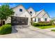 Contemporary home featuring a stylish garage door, concrete driveway, and tidy landscaping at 10206 E Texas Ave, Mesa, AZ 85212