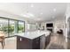 Open-concept kitchen with large island, stainless steel appliances, and seamless access to the living area at 10206 E Texas Ave, Mesa, AZ 85212