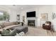 Comfortable living room features neutral colors, a gray fireplace, and lots of natural light at 10206 E Texas Ave, Mesa, AZ 85212