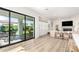 Bright open concept with a large sliding glass door to the patio and neutral decor at 10206 E Texas Ave, Mesa, AZ 85212