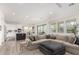 Open-concept living room with kitchen, stylish décor, and lots of natural light at 10206 E Texas Ave, Mesa, AZ 85212