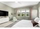 Cozy main bedroom with multiple windows, calming colors, and a comfortable sitting area at 10206 E Texas Ave, Mesa, AZ 85212