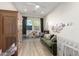 Spacious playroom with hardwood floors, a plush sofa, and a cozy play tent at 10206 E Texas Ave, Mesa, AZ 85212