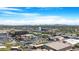 Expansive aerial view of the city, featuring businesses, landmarks, and a water tower against a backdrop of blue sky at 1049 N Monterey St, Gilbert, AZ 85233