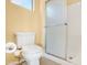 This bathroom features a clean white toilet, shower and tile flooring at 1049 N Monterey St, Gilbert, AZ 85233