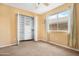 Bedroom featuring a window, closet with shelving, carpet and a ceiling fan at 1049 N Monterey St, Gilbert, AZ 85233