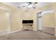 Bedroom featuring a mirrored closet, two computer screens, a ceiling fan and carpet at 1049 N Monterey St, Gilbert, AZ 85233