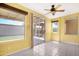 Bright bonus room with natural light and access to a covered patio, perfect for relaxing at 1049 N Monterey St, Gilbert, AZ 85233
