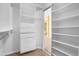The walk-in closet offers lots of storage with custom built-in shelves and drawers at 1049 N Monterey St, Gilbert, AZ 85233