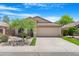 Charming single-story home featuring a well-maintained front yard and a two-car garage at 1049 N Monterey St, Gilbert, AZ 85233