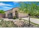 Inviting single-story home showcasing desert landscaping and a covered entryway at 1049 N Monterey St, Gilbert, AZ 85233