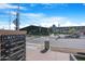 A view of Heritage Marketplace, with visible signage and a variety of shops, framed by trees and clear sky at 1049 N Monterey St, Gilbert, AZ 85233