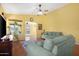 Comfortable living room with plush seating, wooden floors, and views of the backyard patio at 1049 N Monterey St, Gilbert, AZ 85233