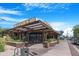 Restaurant exterior with modern architecture, outdoor plants, and visible seating through large windows at 1049 N Monterey St, Gilbert, AZ 85233