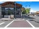 A street view highlights Whiskey Row sign and streetscape with pedestrians crossing and cars parked on the side at 1049 N Monterey St, Gilbert, AZ 85233