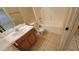 Bathroom features a shower and tub combination, wood cabinets, tile floors and a single sink vanity at 10645 W Piccadilly Rd, Avondale, AZ 85392