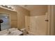 Bathroom features a shower and tub combination, wood cabinets and a single sink vanity at 10645 W Piccadilly Rd, Avondale, AZ 85392