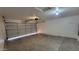 Empty two car garage with painted walls and concrete floors at 10645 W Piccadilly Rd, Avondale, AZ 85392