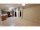 Open living space features tiled floors, wood cabinets, modern appliances, and neutral paint palette at 10645 W Piccadilly Rd, Avondale, AZ 85392