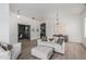 Inviting living room with wood floors, white walls, and a doorway view to office space at 11611 N 149Th Ln, Surprise, AZ 85379