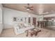 Comfortable living room with an open floor plan, a ceiling fan, and modern decor at 11611 N 149Th Ln, Surprise, AZ 85379