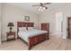 Primary bedroom featuring wood flooring, neutral walls, and a ceiling fan at 11611 N 149Th Ln, Surprise, AZ 85379