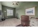 Inviting office space featuring a large window, sleek wood floors, and neutral decor for productivity at 11611 N 149Th Ln, Surprise, AZ 85379