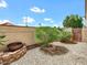 Cozy backyard with decorative rock groundcover, privacy wall, and mature shrubbery at 11889 N 113Th Pl, Scottsdale, AZ 85259