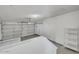 Spacious two-car garage with an automatic door and built-in shelving at 11889 N 113Th Pl, Scottsdale, AZ 85259